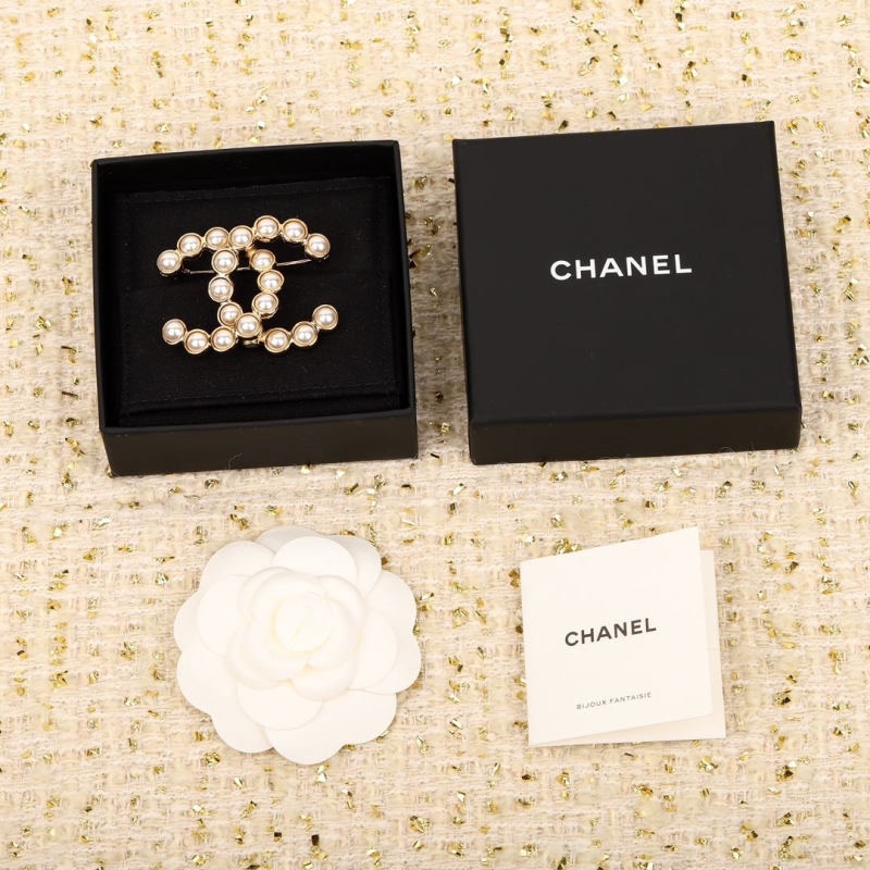 Ch*el brooches